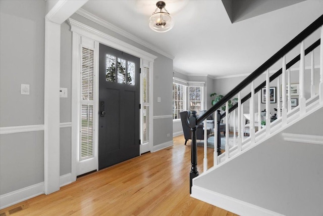 519 Long Hill Rd, Gurnee, IL 60031 - entrance foyer with stairway, wood finished floors, ornamental molding, and baseboards