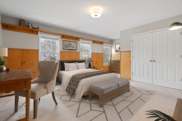 519 Long Hill Rd, Gurnee, IL 60031 - carpeted bedroom featuring a wainscoted wall, wood walls, and a closet