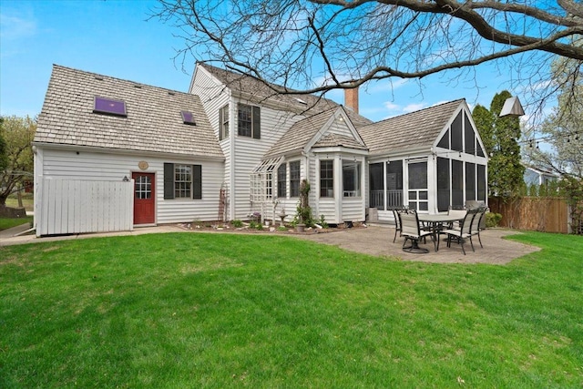 519 Long Hill Rd, Gurnee, IL 60031 - back of house with a chimney, a sunroom, and a patio area
