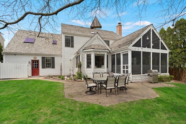 519 Long Hill Rd, Gurnee, IL 60031 - back of house featuring a patio, a chimney, and a sunroom