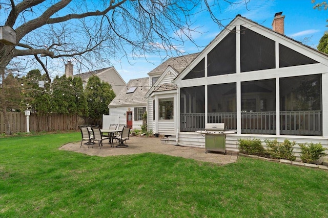 519 Long Hill Rd, Gurnee, IL 60031 - rear view of property with a sunroom, a patio area, and a chimney