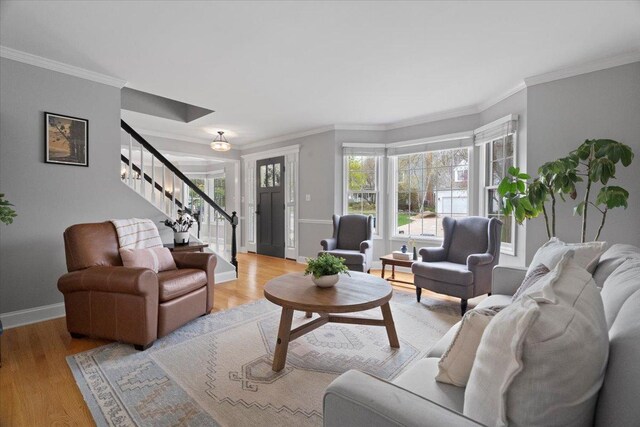 519 Long Hill Rd, Gurnee, IL 60031 - living room featuring stairway, crown molding, baseboards, and light wood-style floors