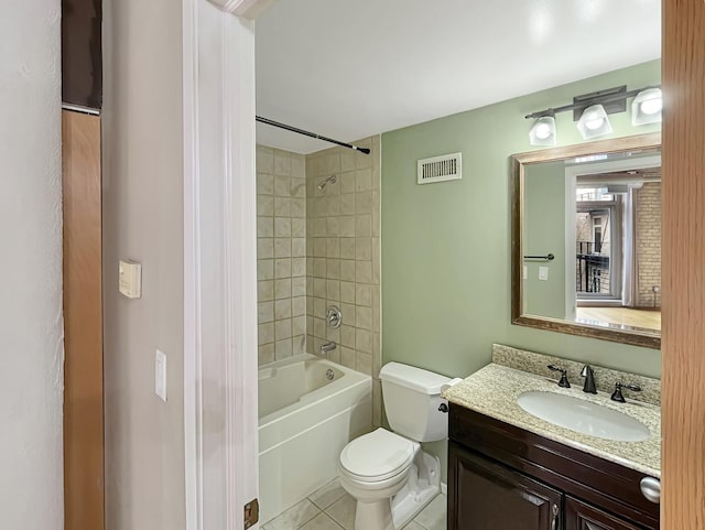 full bathroom with toilet, tile patterned floors, vanity, and bathtub / shower combination