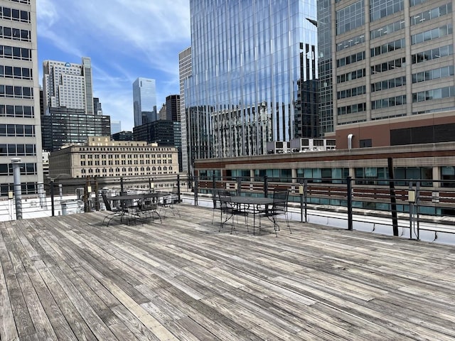 wooden deck featuring a skyline view