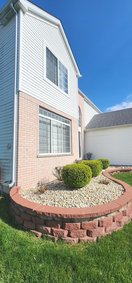view of property exterior with brick siding