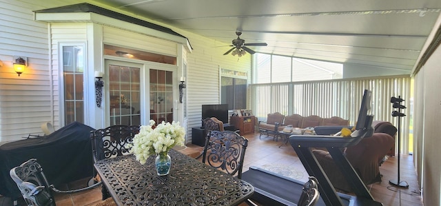 sunroom / solarium with ceiling fan and an outdoor hangout area