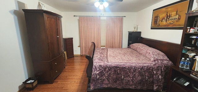 bedroom with wood finished floors and a ceiling fan