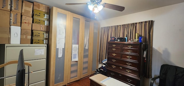 bedroom featuring wood finished floors and a ceiling fan