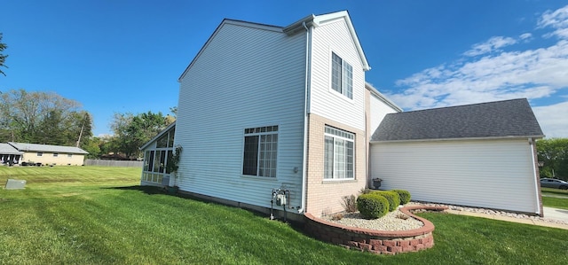 view of home's exterior featuring a lawn and brick siding