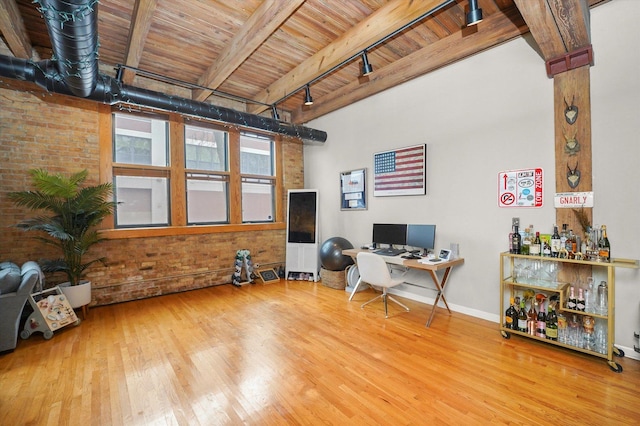 2435 N Sheffield Ave Unit 10, Chicago, IL 60614 - office area with wood finished floors, brick wall, wooden ceiling, baseboards, and beam ceiling