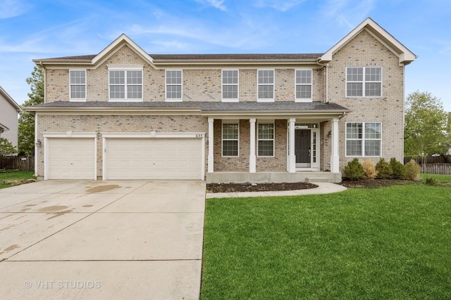 635 Mansfield Way, Oswego, IL 60543 - traditional-style house featuring a porch, driveway, an attached garage, and brick siding