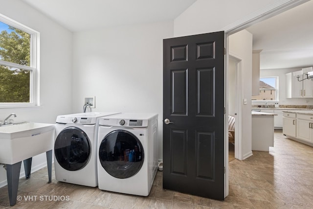 635 Mansfield Way, Oswego, IL 60543 - washroom with separate washer and dryer and a chandelier