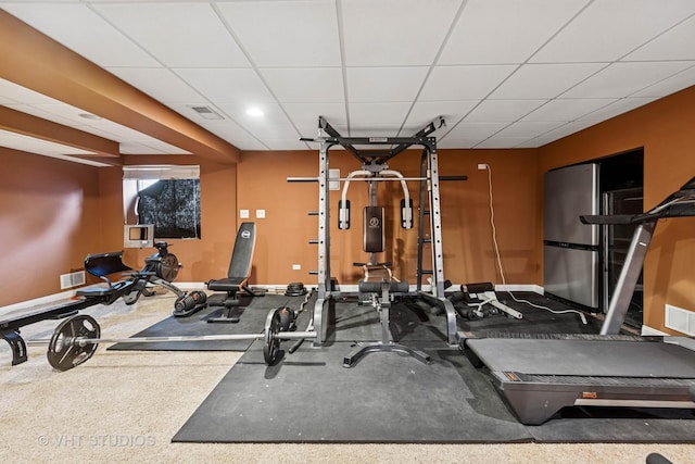 635 Mansfield Way, Oswego, IL 60543 - exercise room featuring baseboards and a paneled ceiling