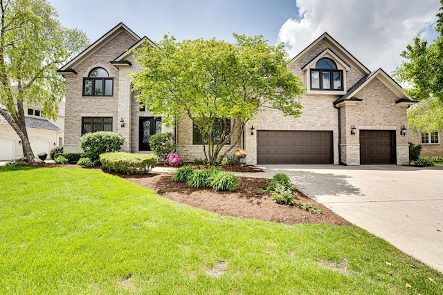 1565 Winberie Ct, Naperville, IL 60564 - view of front of property with a front lawn, driveway, an attached garage, and brick siding