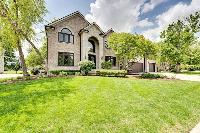 1565 Winberie Ct, Naperville, IL 60564 - french provincial home featuring driveway, brick siding, a front lawn, and an attached garage