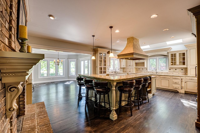 1565 Winberie Ct, Naperville, IL 60564 - kitchen featuring cream cabinets, healthy amount of natural light, dark wood-style floors, and recessed lighting