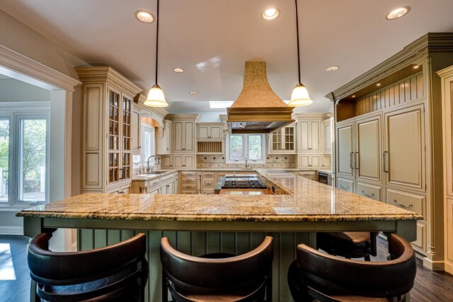 1565 Winberie Ct, Naperville, IL 60564 - kitchen with cream cabinetry, a large island, glass insert cabinets, and recessed lighting