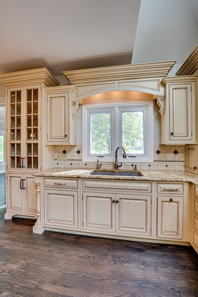 1565 Winberie Ct, Naperville, IL 60564 - kitchen with a sink, cream cabinetry, backsplash, and light stone counters
