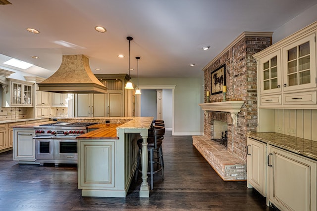 1565 Winberie Ct, Naperville, IL 60564 - kitchen with cream cabinetry, island range hood, and recessed lighting