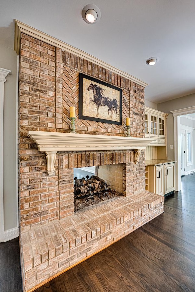 1565 Winberie Ct, Naperville, IL 60564 - detailed view of a brick fireplace, baseboards, and wood finished floors