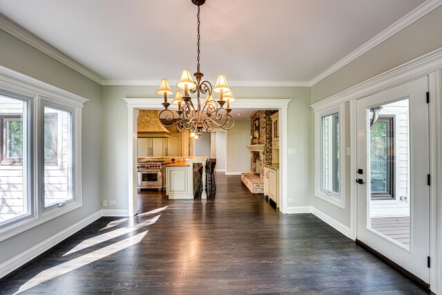 1565 Winberie Ct, Naperville, IL 60564 - unfurnished dining area featuring healthy amount of natural light, dark wood finished floors, a chandelier, and ornamental molding