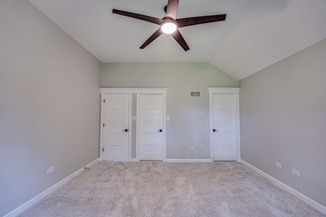 1565 Winberie Ct, Naperville, IL 60564 - unfurnished bedroom with light colored carpet, vaulted ceiling, baseboards, and ceiling fan