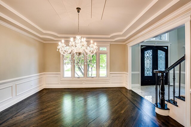 1565 Winberie Ct, Naperville, IL 60564 - entrance foyer with a raised ceiling, wood finished floors, a chandelier, stairway, and wainscoting