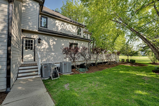 1565 Winberie Ct, Naperville, IL 60564 - view of home's exterior featuring a lawn, cooling unit, and entry steps