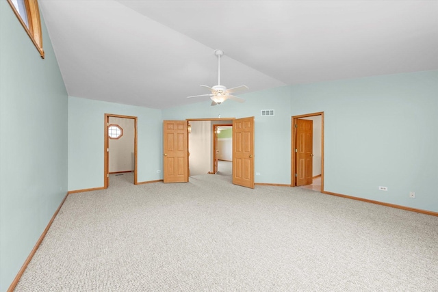 11046 Quail Dr, Mokena, IL 60448 - unfurnished bedroom featuring light carpet, vaulted ceiling, baseboards, and a ceiling fan
