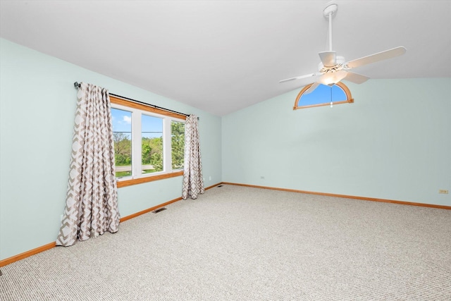 11046 Quail Dr, Mokena, IL 60448 - carpeted spare room with lofted ceiling, baseboards, and a ceiling fan