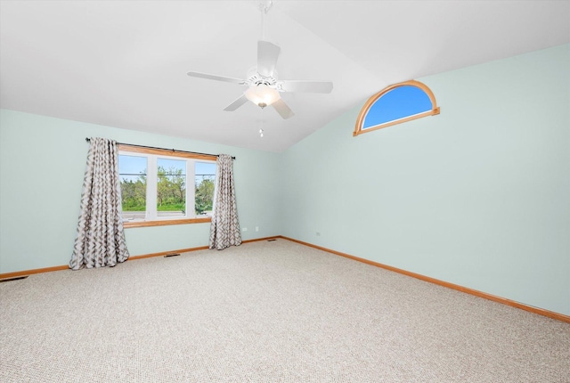 11046 Quail Dr, Mokena, IL 60448 - empty room featuring baseboards, carpet, vaulted ceiling, and ceiling fan