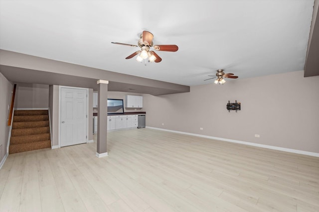 11046 Quail Dr, Mokena, IL 60448 - unfurnished living room featuring a ceiling fan, light wood-style flooring, baseboards, and stairway
