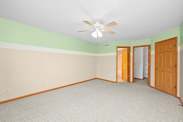 11046 Quail Dr, Mokena, IL 60448 - unfurnished bedroom featuring light colored carpet, baseboards, a closet, and a ceiling fan