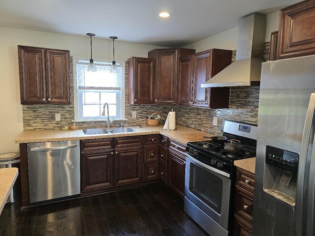 320 N Pearl St, Forrest, IL 61741 - kitchen featuring stainless steel appliances, a sink, wall chimney range hood, light countertops, and dark wood-style floors
