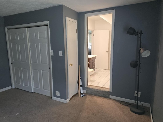 320 N Pearl St, Forrest, IL 61741 - unfurnished bedroom with carpet floors, a closet, and baseboards