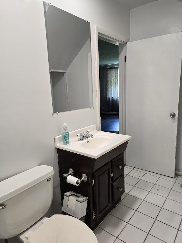 320 N Pearl St, Forrest, IL 61741 - bathroom with toilet, vanity, and tile patterned floors