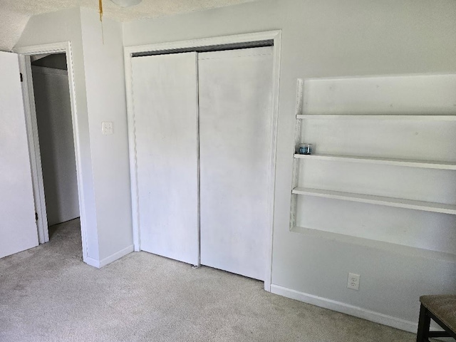 320 N Pearl St, Forrest, IL 61741 - unfurnished bedroom featuring carpet flooring, a closet, and baseboards