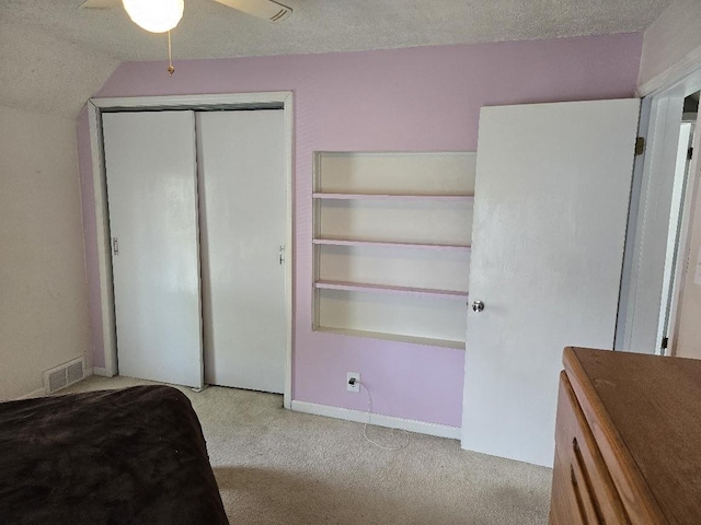 320 N Pearl St, Forrest, IL 61741 - bedroom with carpet floors, a textured ceiling, a closet, and baseboards