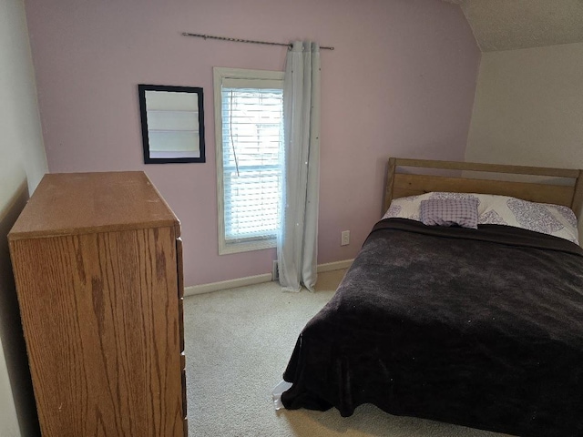 320 N Pearl St, Forrest, IL 61741 - bedroom with carpet floors, vaulted ceiling, and baseboards
