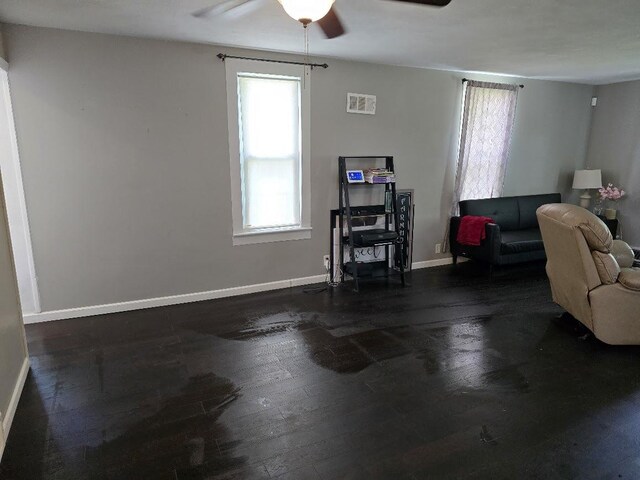 320 N Pearl St, Forrest, IL 61741 - living room featuring ceiling fan, hardwood / wood-style floors, and baseboards
