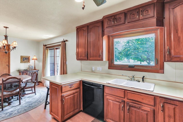 7 Birch Ln, Villa Grove, IL 61956 - kitchen featuring black dishwasher, a sink, a peninsula, plenty of natural light, and a textured ceiling