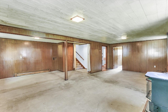 7 Birch Ln, Villa Grove, IL 61956 - finished below grade area with stairs, wooden walls, and a baseboard heating unit