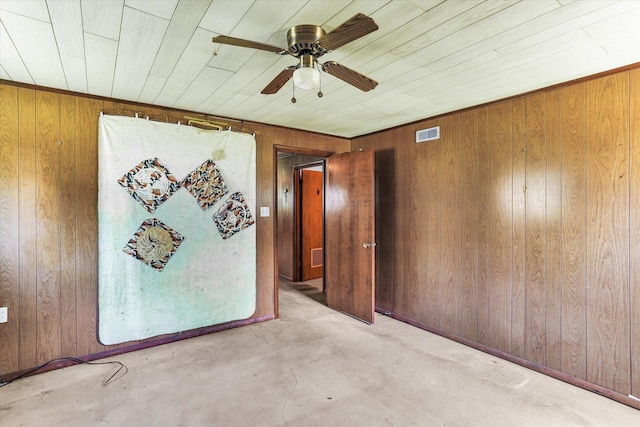 7 Birch Ln, Villa Grove, IL 61956 - unfurnished room with wood walls, a ceiling fan, and unfinished concrete floors