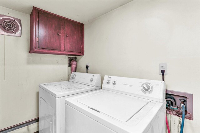 7 Birch Ln, Villa Grove, IL 61956 - laundry area featuring cabinet space and washing machine and clothes dryer