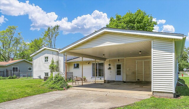 7 Birch Ln, Villa Grove, IL 61956 - rear view of property with concrete driveway and an attached carport