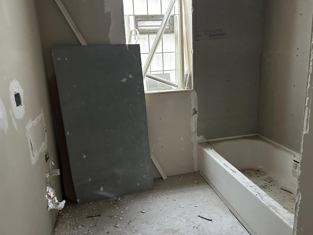 full bathroom with a tub to relax in