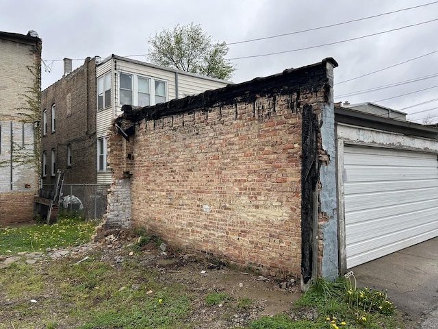 view of side of property featuring an attached garage