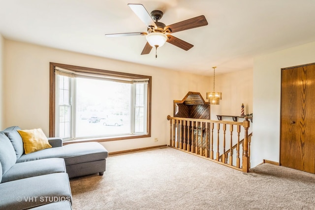 898 Shorewood Dr, Bartlett, IL 60103 - carpeted living area featuring baseboards, ceiling fan, and a chandelier