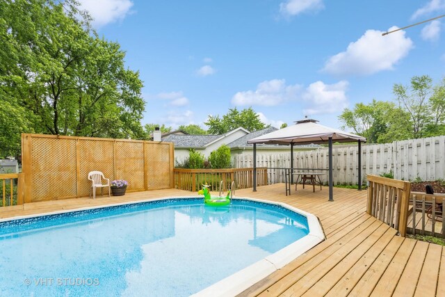 898 Shorewood Dr, Bartlett, IL 60103 - view of pool featuring a gazebo, a deck, and a fenced backyard
