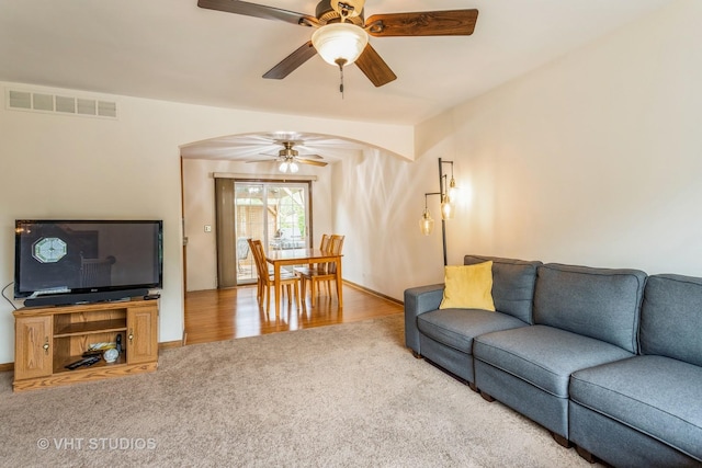 898 Shorewood Dr, Bartlett, IL 60103 - carpeted living room with arched walkways and a ceiling fan